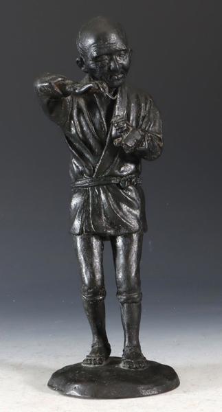 Asiatisk figur i malt messing.