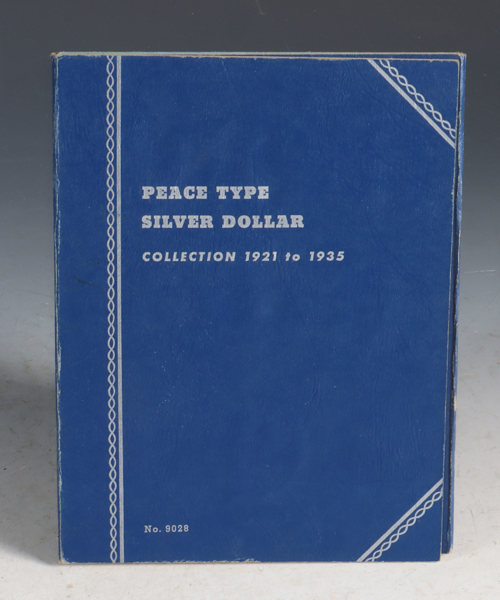 Album med mynter. Silver Dollar.