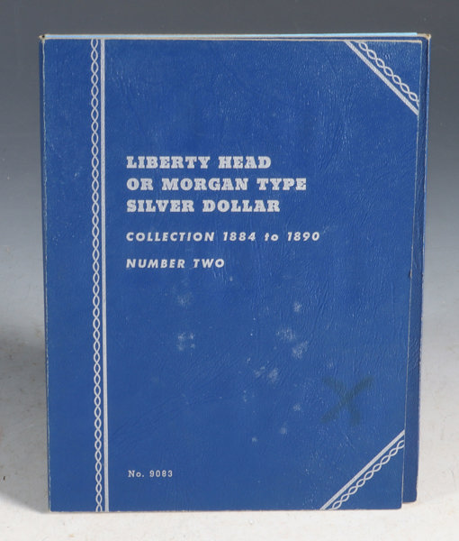 Album med mynter. Silver dollars.