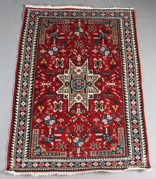 Lite håndknyttet teppe