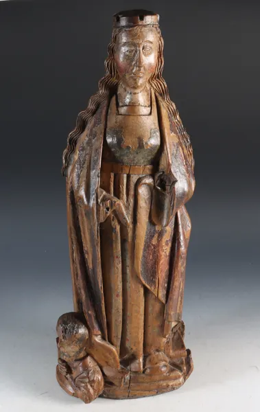 Utskåret og malt kvinnefigur av en helgen.