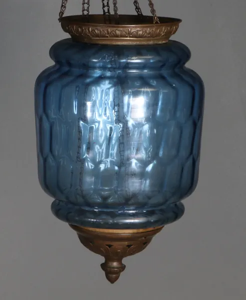 Måneskinnslampe i blått glass.